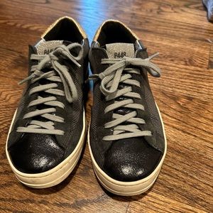 Black P448 sneakers with metallic detailing